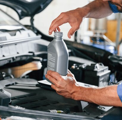 Genuine MAK lubricant being installed at a garage