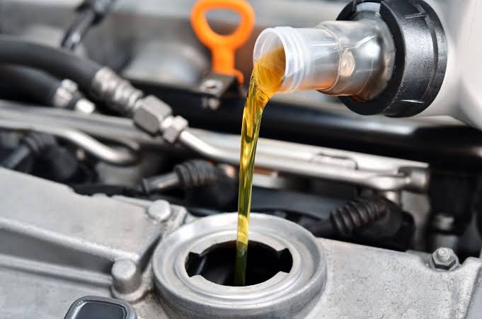 Genuine engine oil being poured at Sri Hari Tex